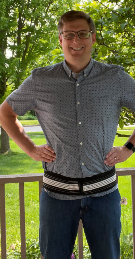 Man wearing the lumbar sciatica brace outdoors